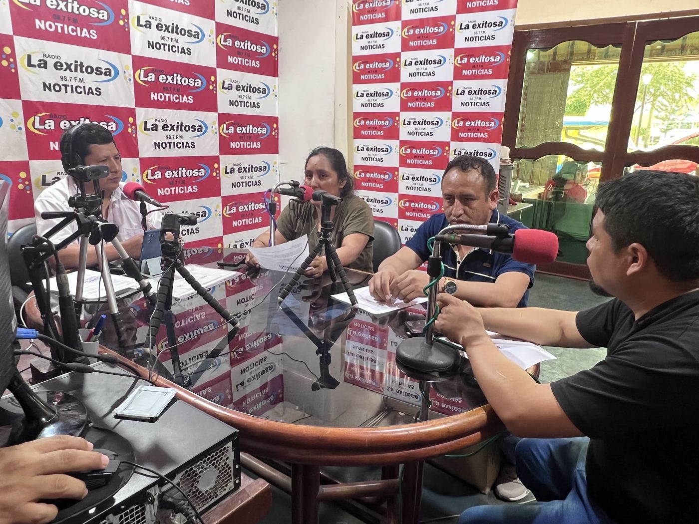 Union leaders speak on air in a local radio studio